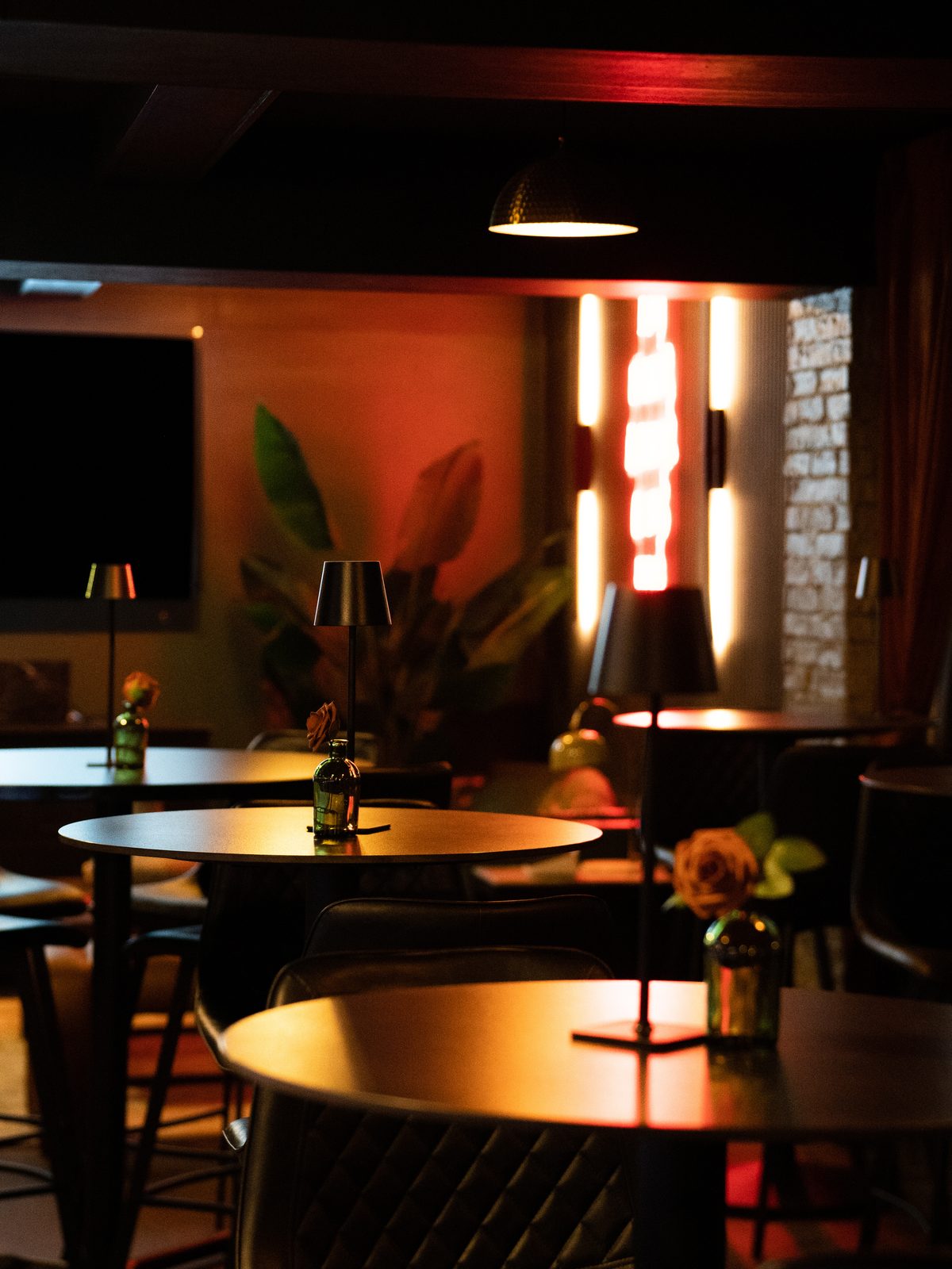 Warm lounge tables and lamplight